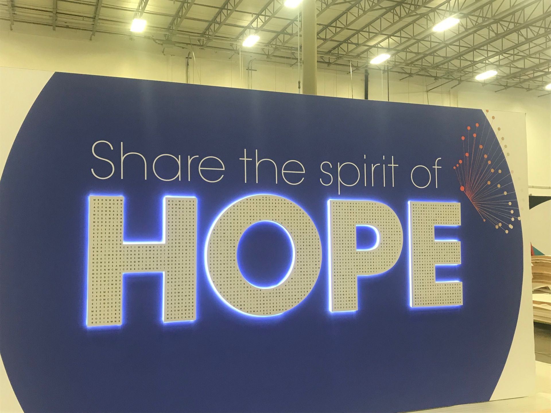 Lit Up Sign that says Share the spirit of Hope