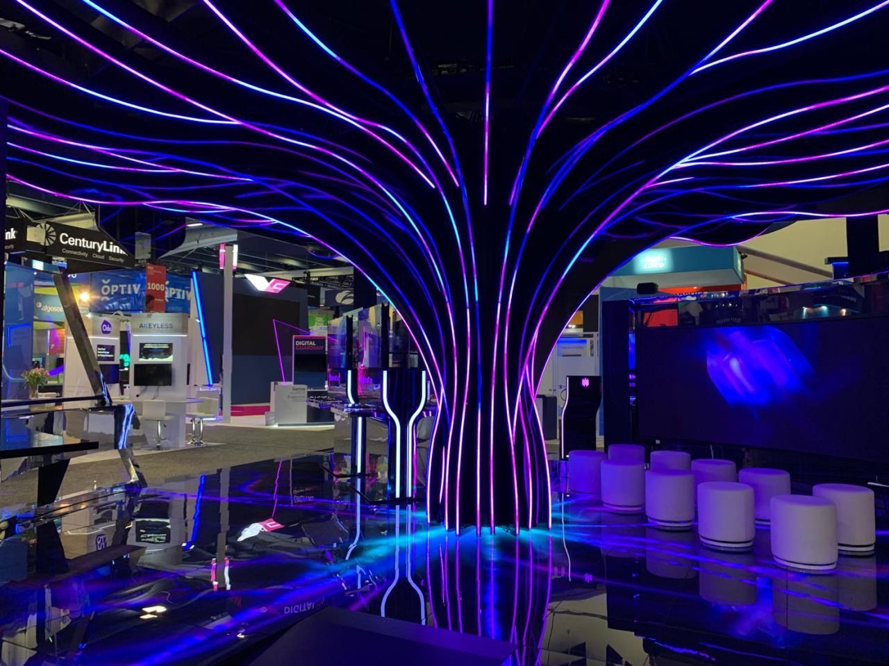 A room with purple and blue lights on the ceiling