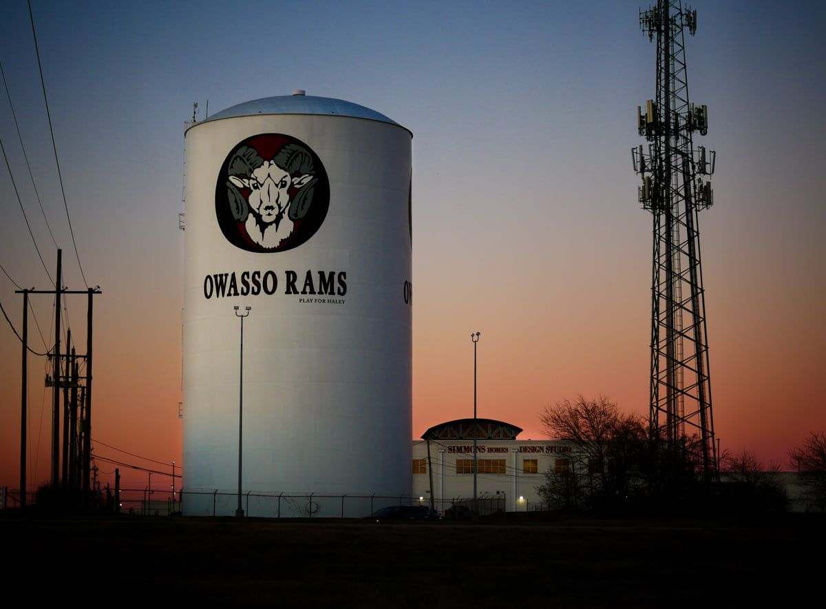 A water tower with oklsso rams written on it