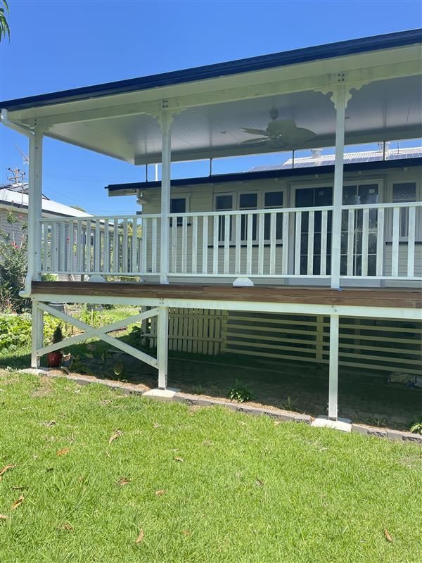 A Wooden Dresser With Drawers And A Shelf In A Living Room — Green e Building in Lennox Head, NSW