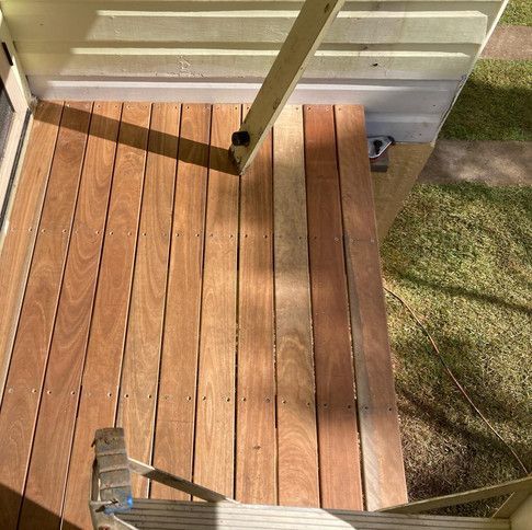 A Wooden Deck With Stairs Leading Up To It — Green e Building in Lennox Head, NSW