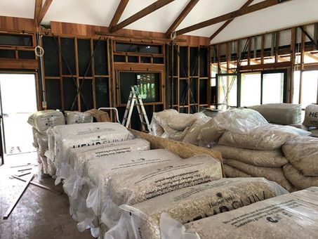 A Room With A Lot Of Bags Stacked On Top Of Each Other — Green e Building in Lennox Head, NSW