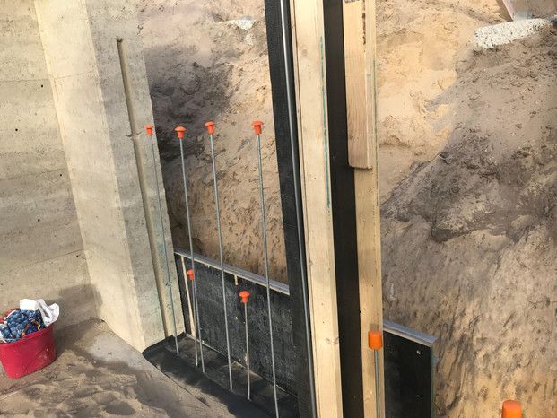 A Concrete Wall Is Being Built In A Hole In The Ground — Green e Building in Lennox Head, NSW