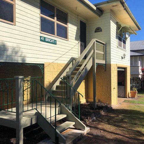 A House With Stairs And A Sign That Says 41 Bright — Green e Building in Lennox Head, NSW