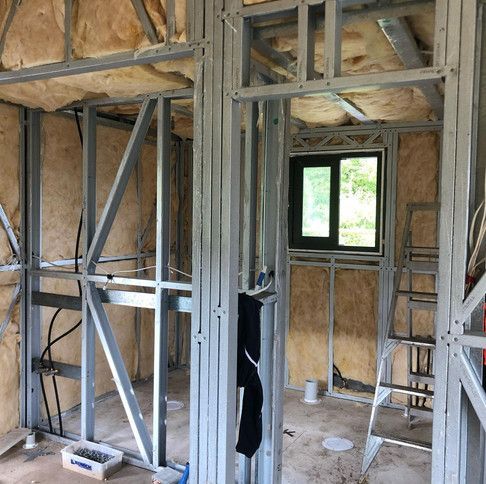 A Room With A Window And A Ladder In It Is Being Built — Green e Building in Lennox Head, NSW