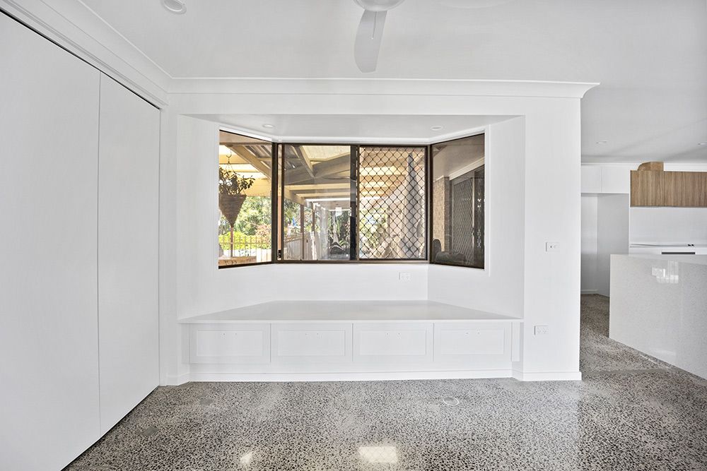 An Empty Room With A Bay Window And A Ceiling Fan — Green e Building in Bangalow, NSW