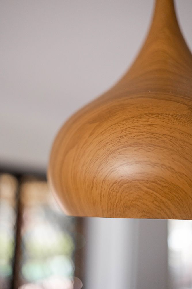 A Close Up Of A Wooden Pendant Light Hanging From The Ceiling — Green e Building in Mullumbimby, NSW