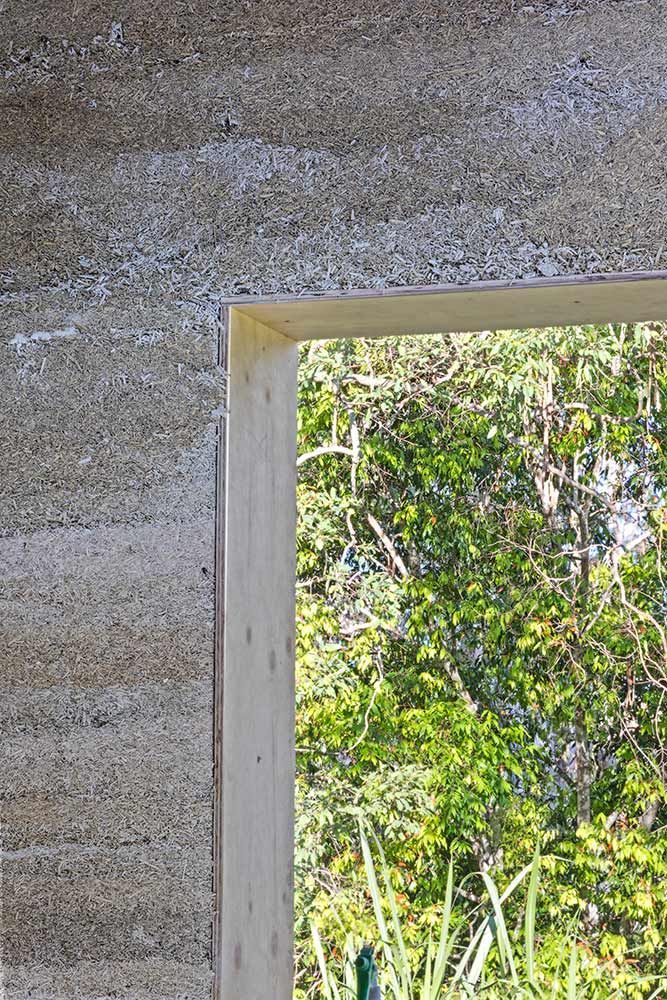 A Window With A Wooden Frame Is Looking Out To A Forest — Green e Building in Currumbin Valley, QLD