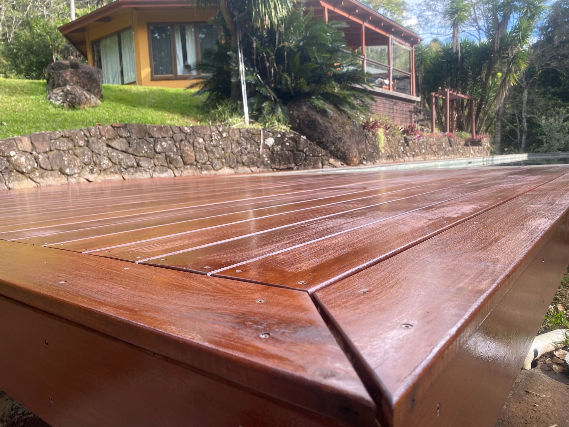 A Wooden Deck With Stairs Leading Up To It — Green e Building in Lennox Head, NSW