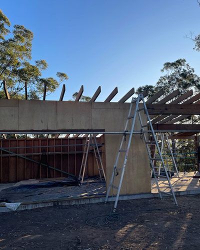 A Ladder Is Sitting In Front Of A Building Under Construction — Green e Building in Kyogle, NSW