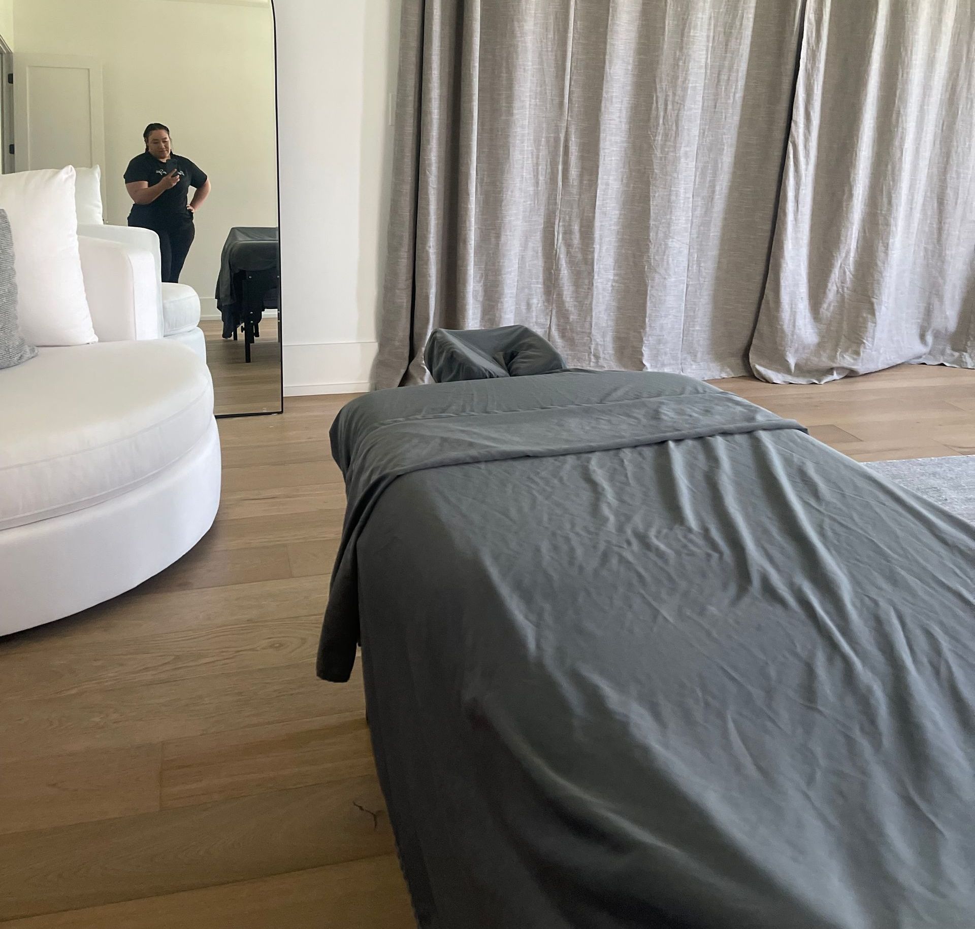 A man is taking a picture of himself in a living room