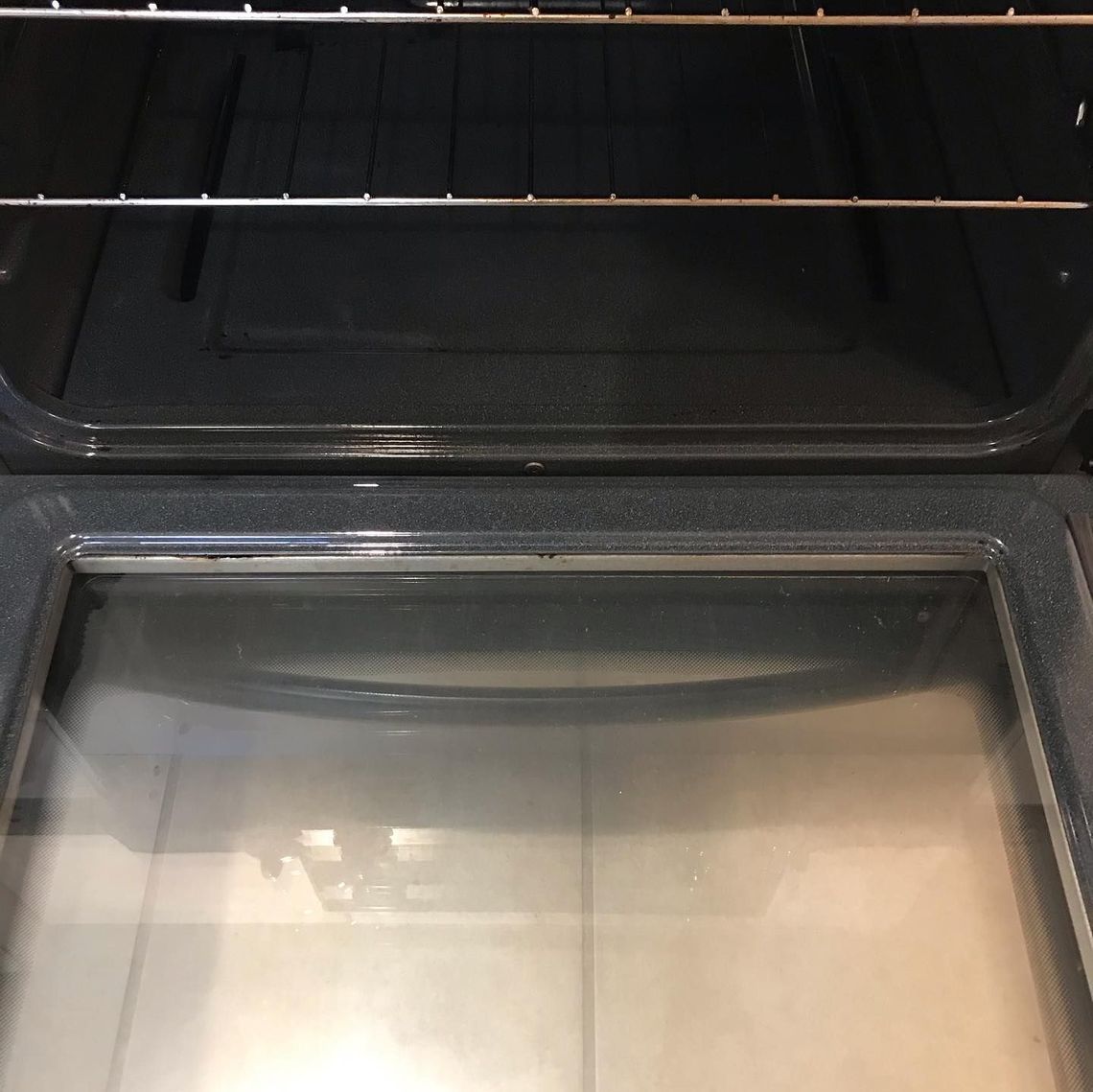 The inside of an oven with the door open