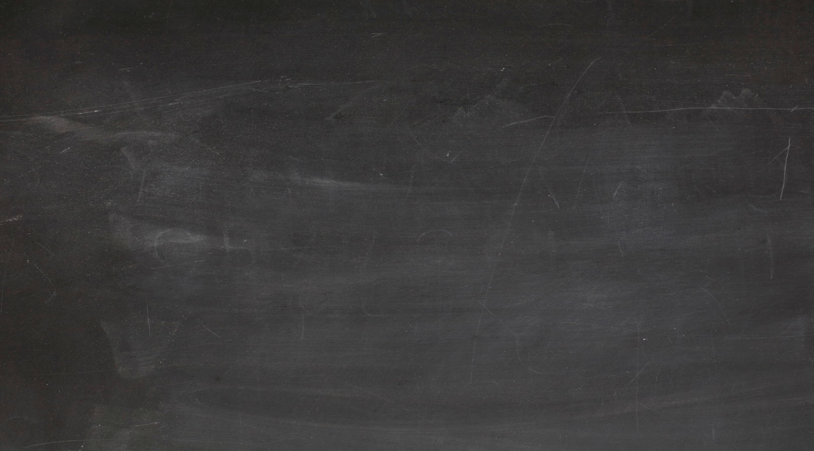 A close up of a blackboard with a lot of chalk on it.