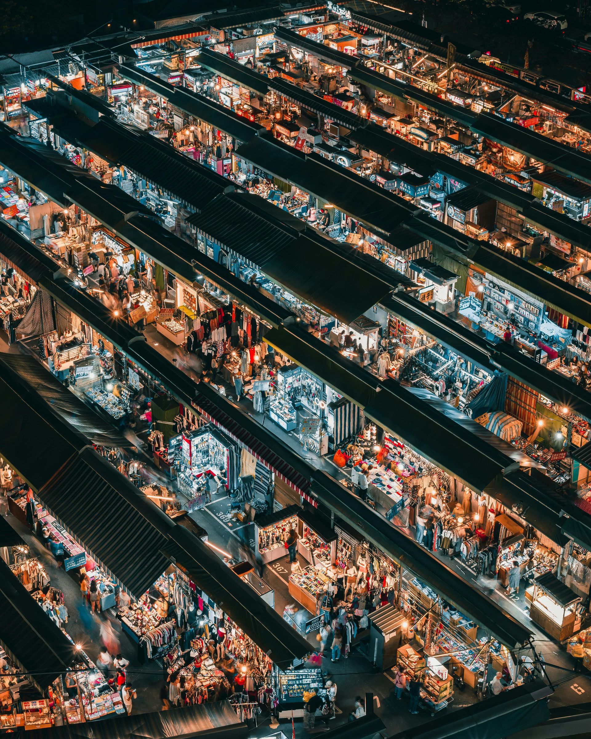 An aerial view of a busy market at night.
