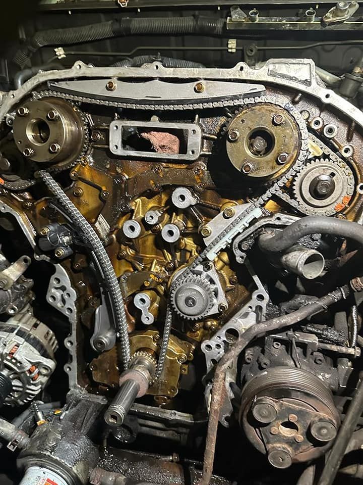 A close up of a car engine with a lot of gears.
