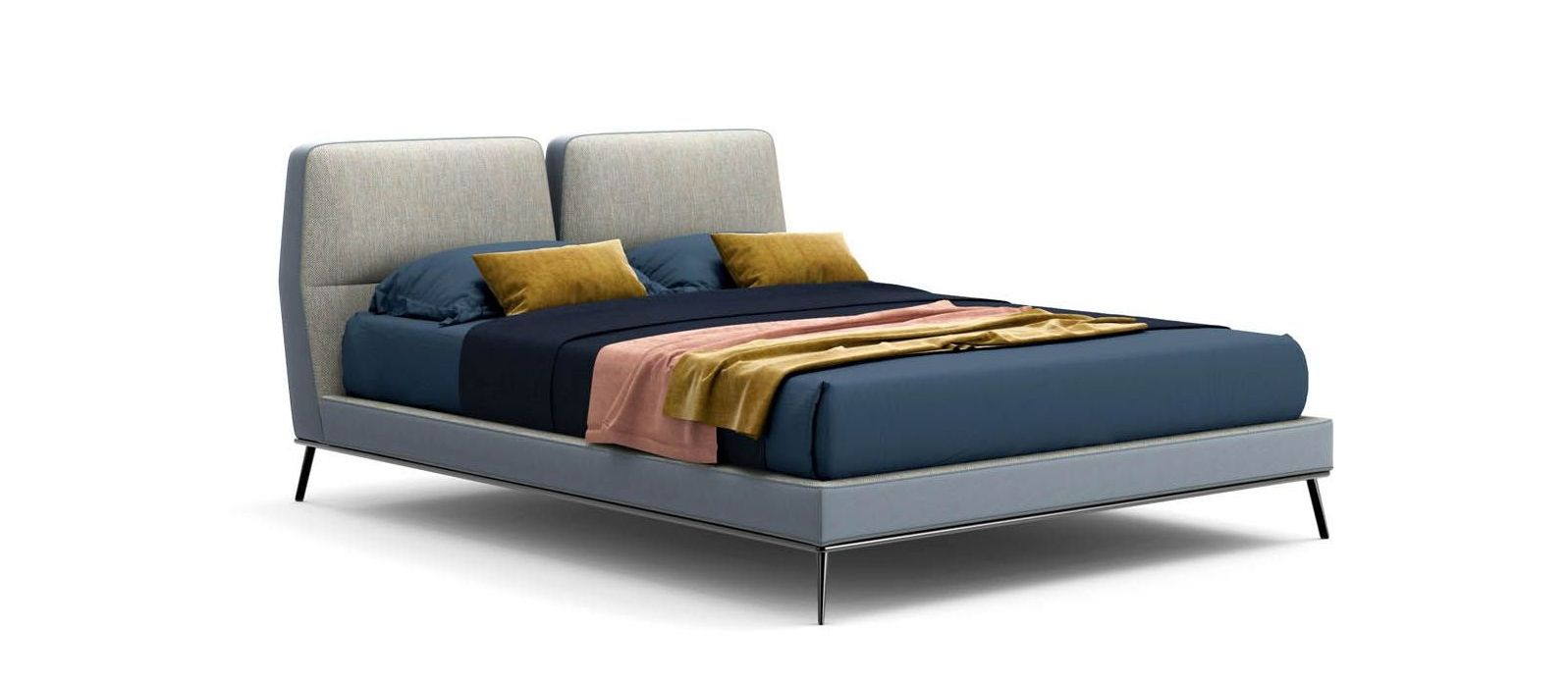 Un letto con lenzuola e cuscini blu su sfondo bianco