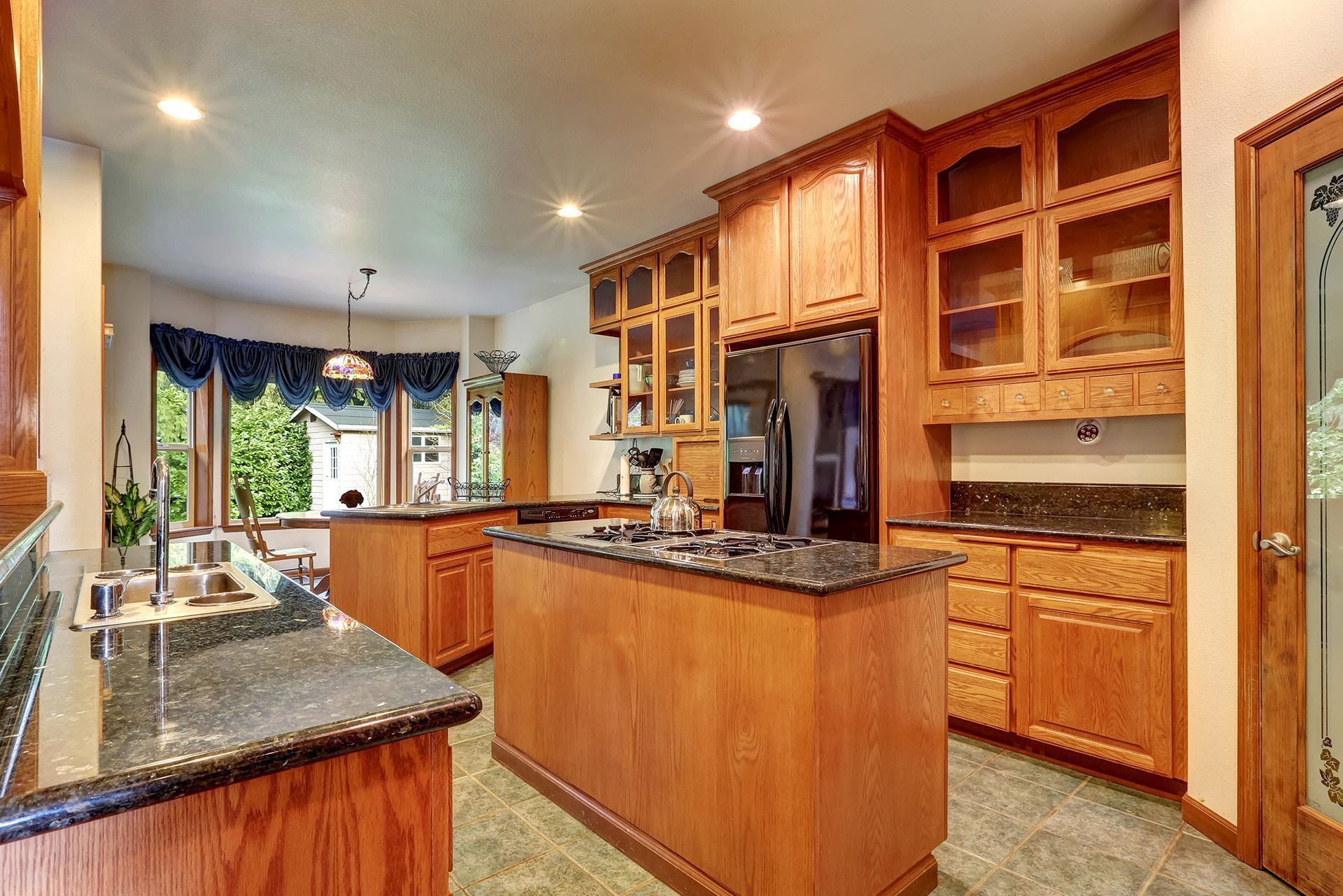 Wooden beams forming an X shape against a wooden ceiling.