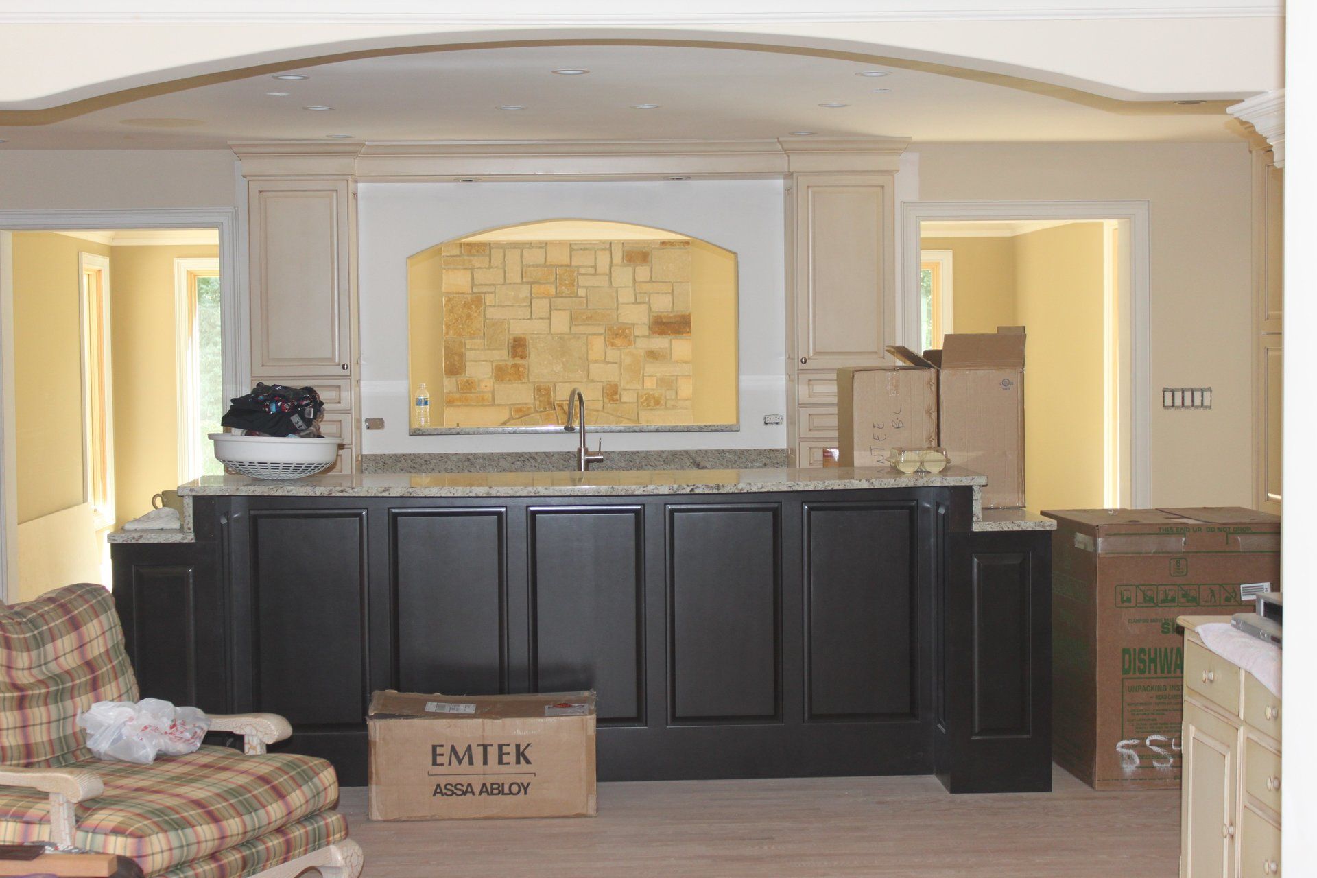 A living room with a couch and a box that says fmtk on it