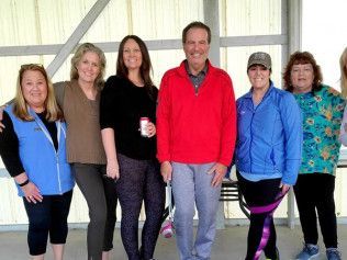 A group of people are posing for a picture together.