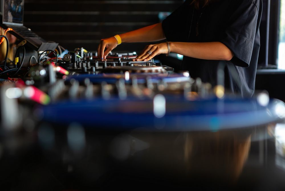 a person is playing a musical instrument in a dark room .