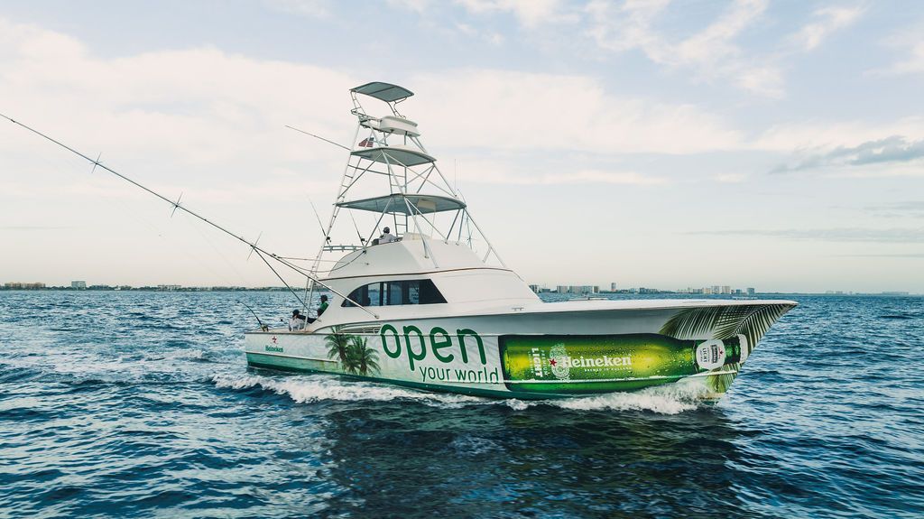 A large boat is floating on top of a body of water.