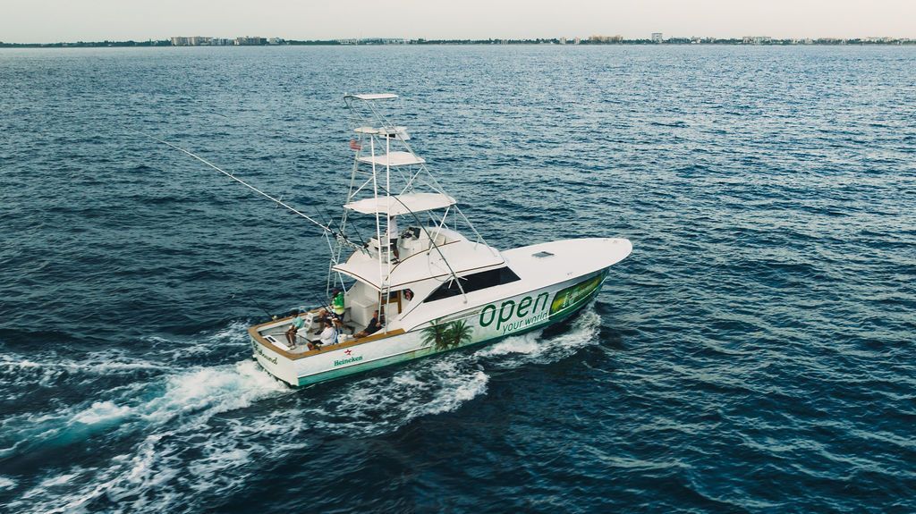 A boat is floating on top of a large body of water.