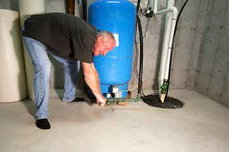 Man Opening Sump Pump — Toledo, OH — Alternative Plumbing Plus, Inc.