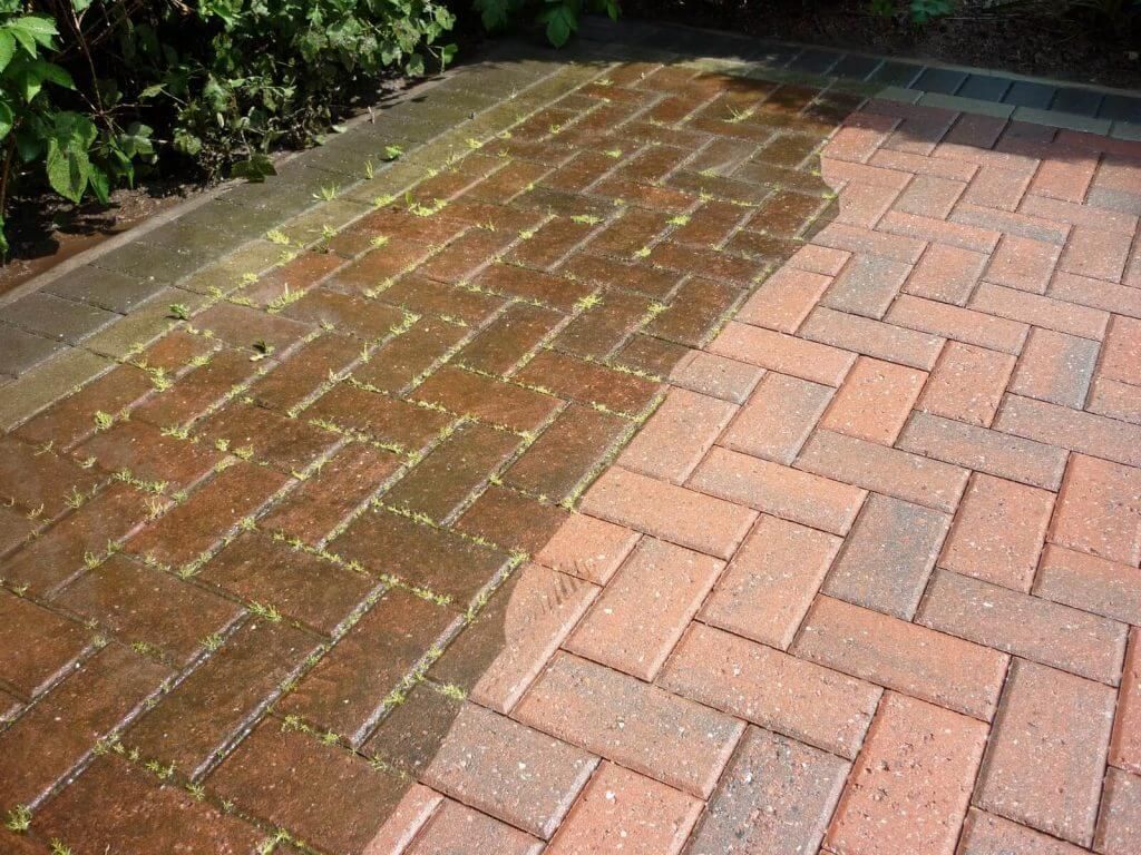 A before and after picture of a brick walkway being cleaned.