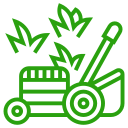 A green lawn mower with leaves coming out of it.