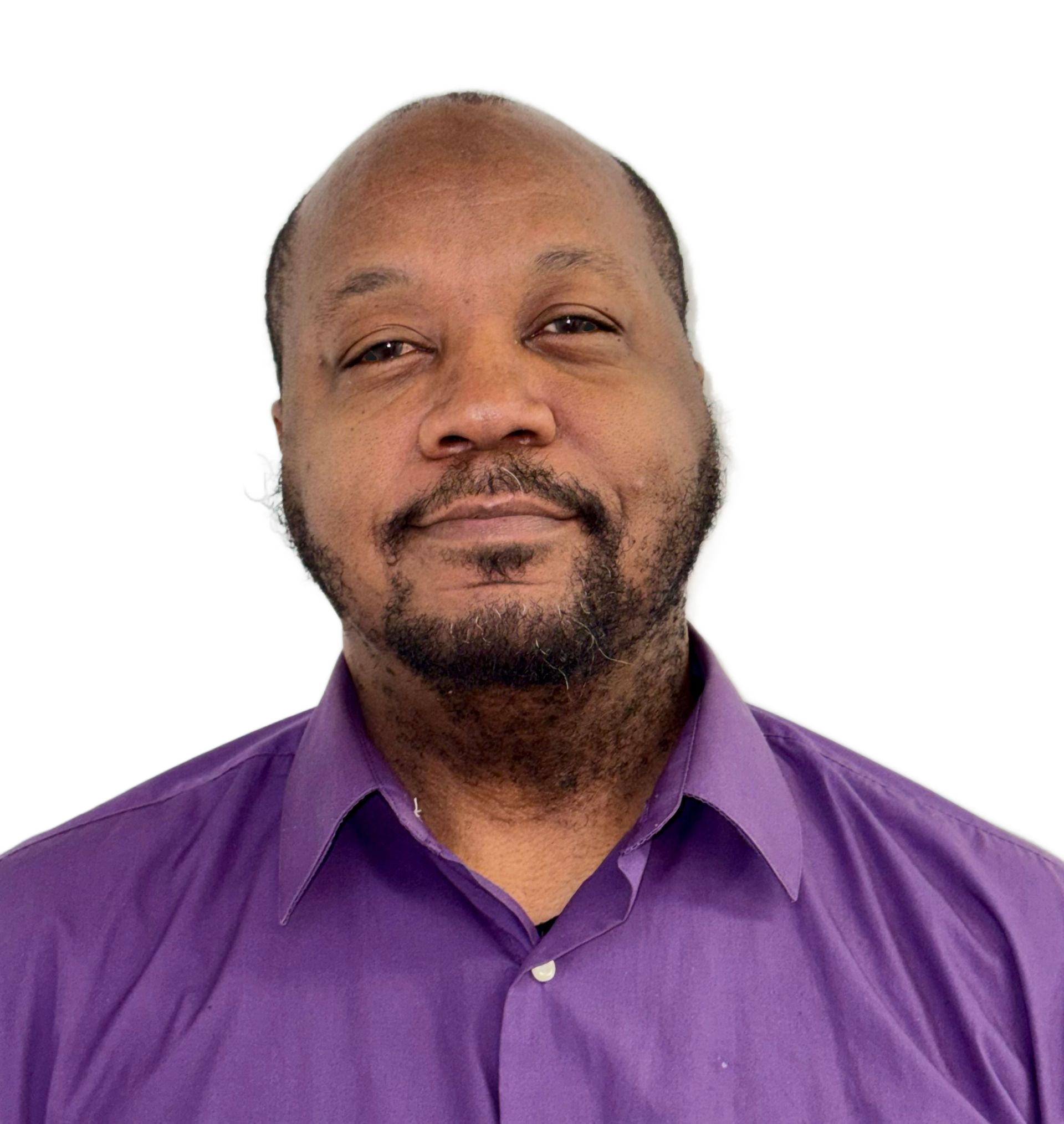 Man smiling in a purple button-up shirt against a white background