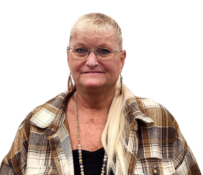 Woman smiling in a black sleeveless top against a white backdrop.
