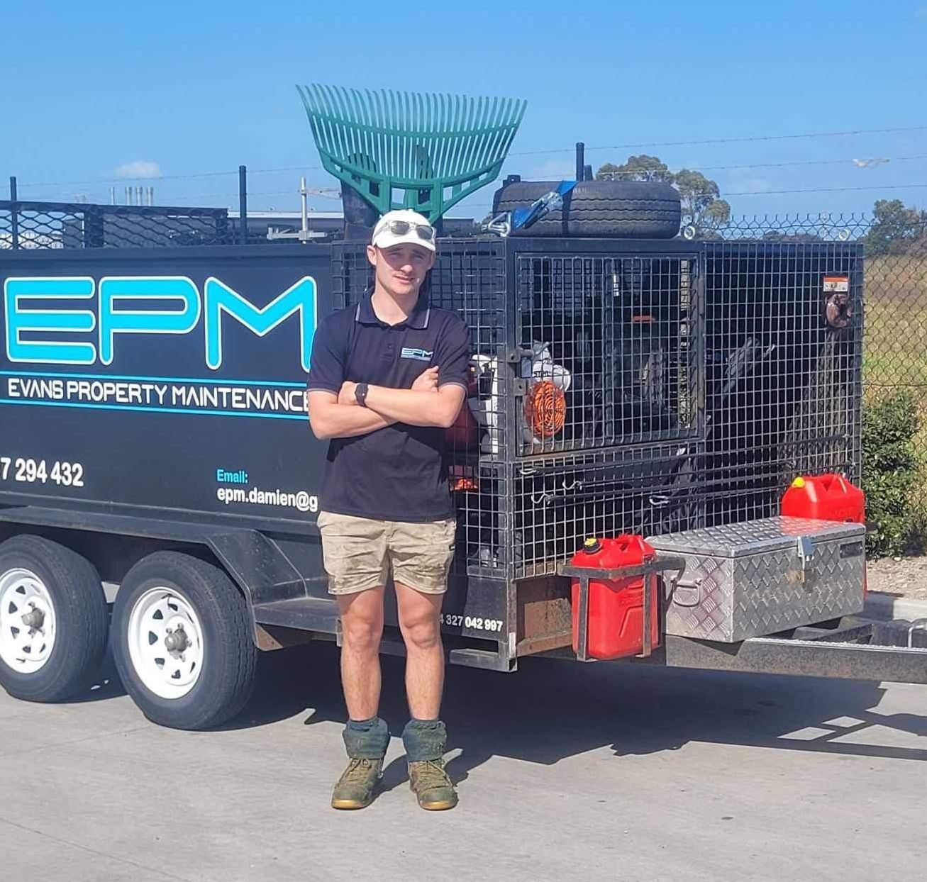 Gardener standing next to his ute