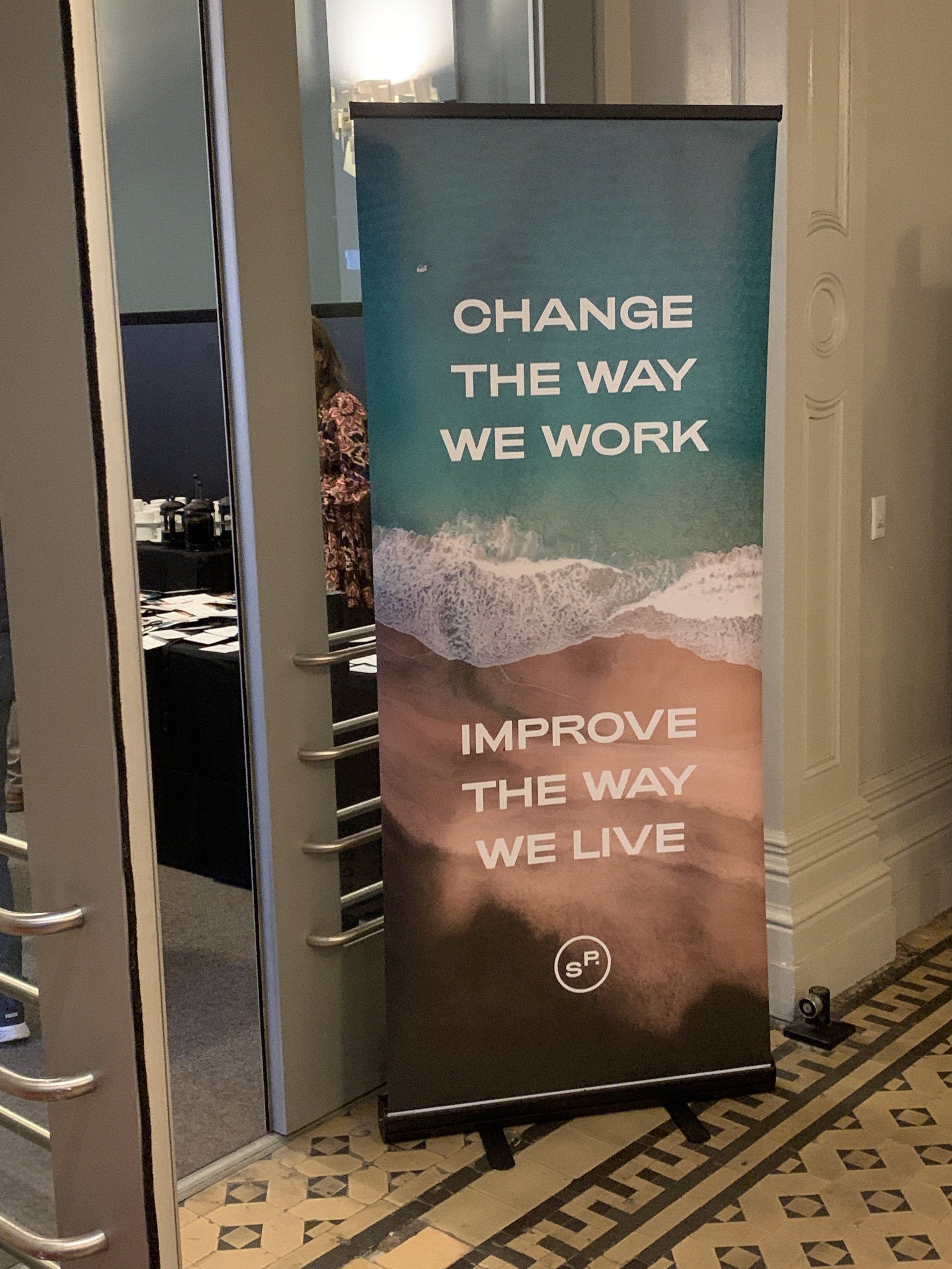 A sign that says change the way we work improve the way we live