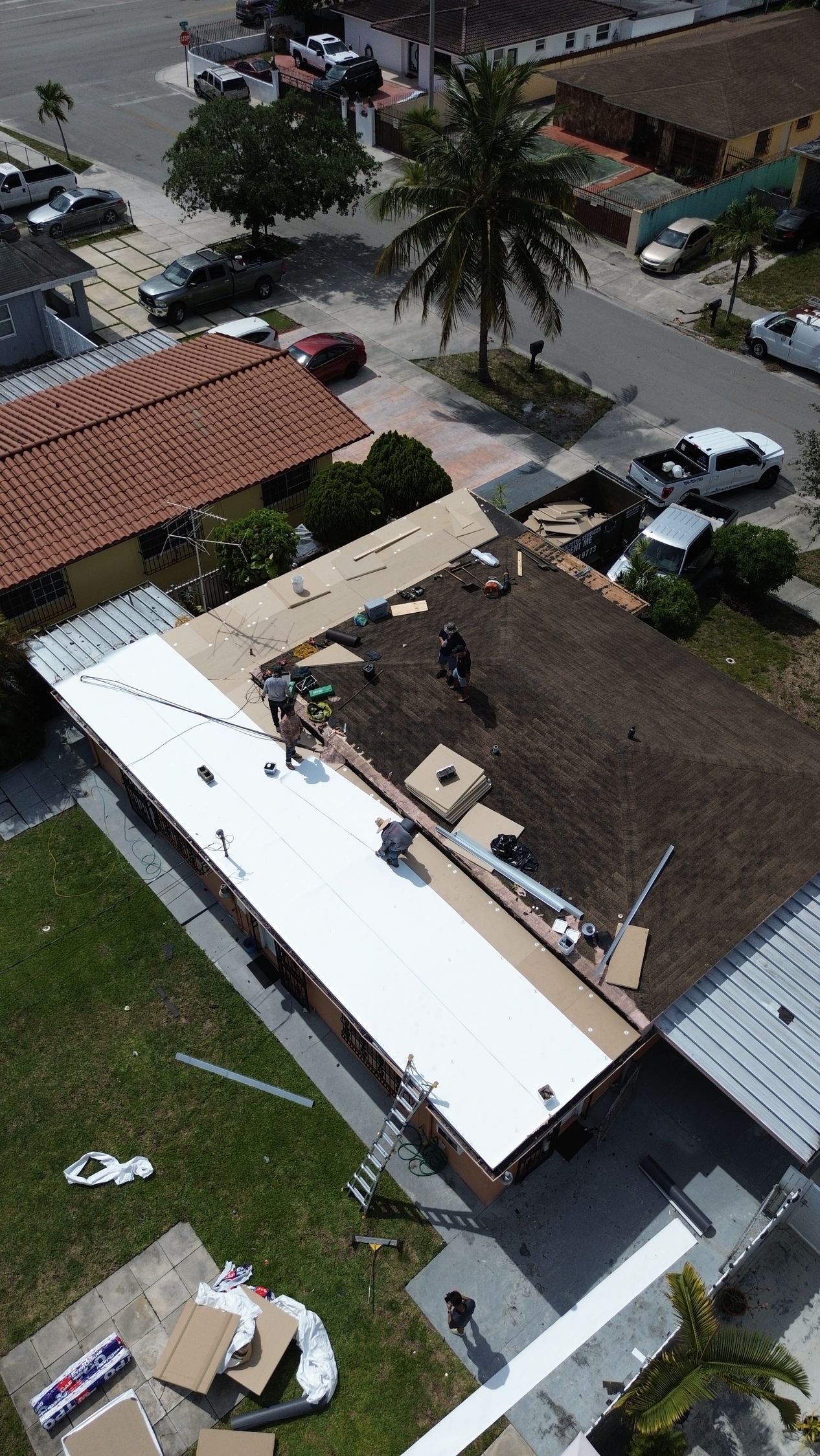 An aerial view of a roof being installed on a house.