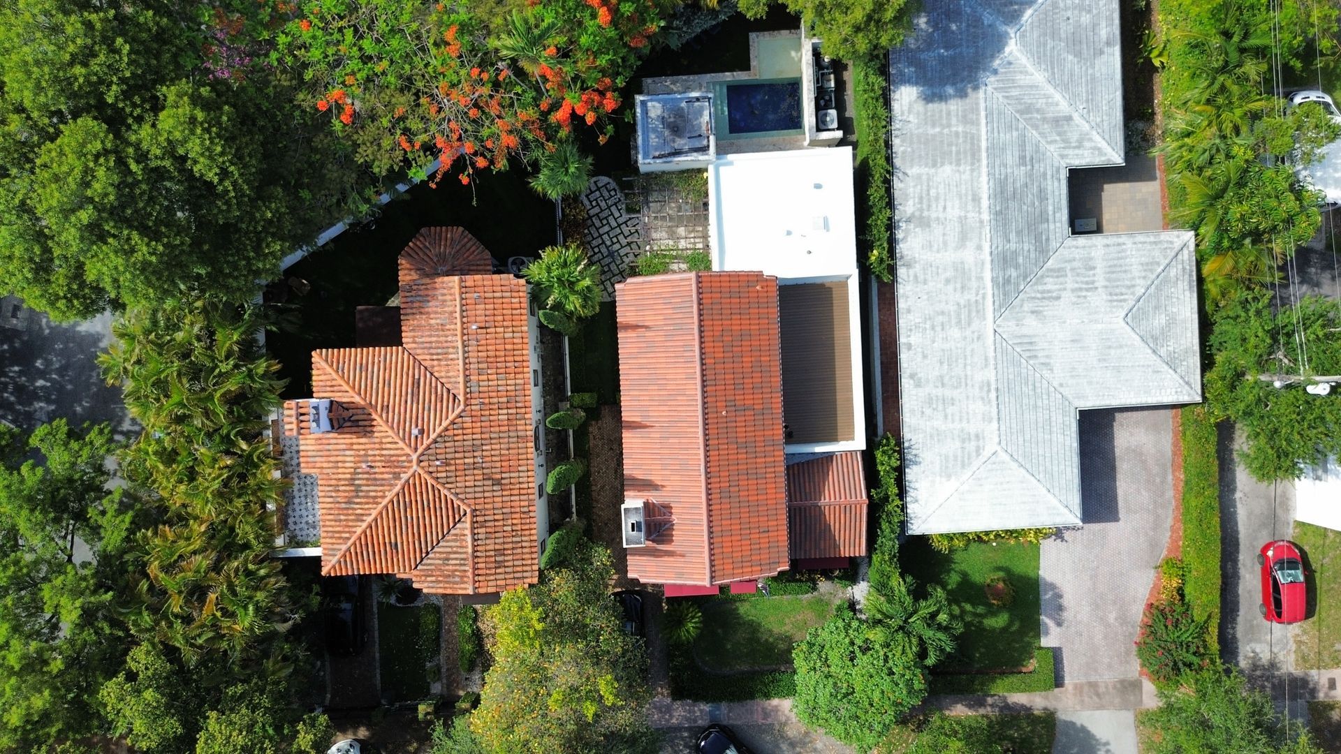 An aerial view of a residential area with houses and trees.