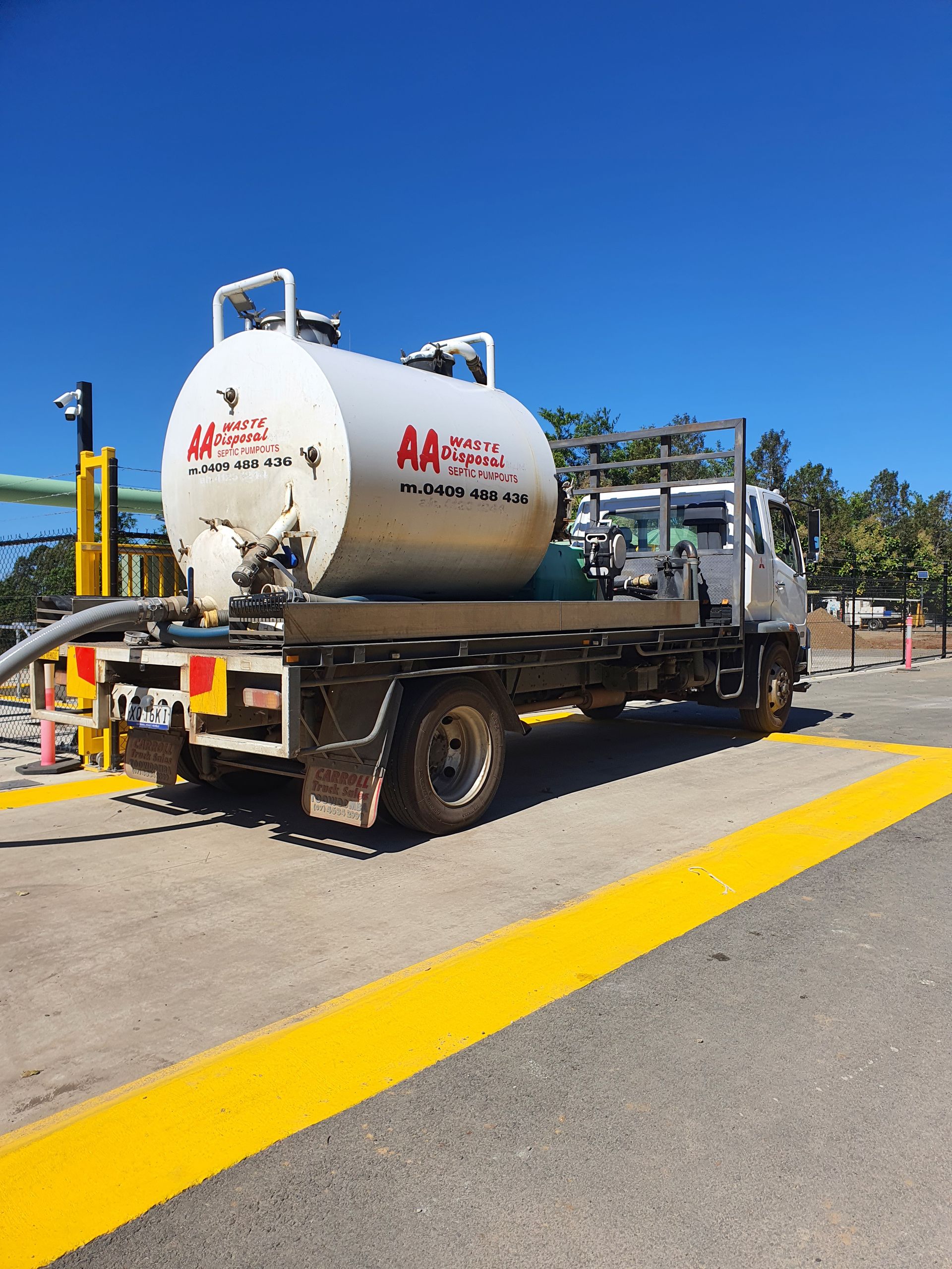 Worker Disposing of Waste from Septic Tank — Waste Disposal in Maryborough, QLD