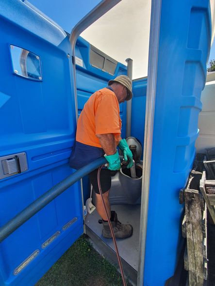 AA Waste Disposal Truck Man Pumping Out Waste From a Portaloo— Waste Disposal in Maryborough, QLD