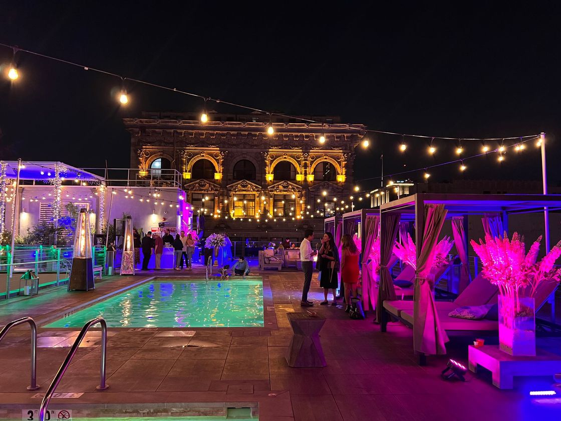 Rooftop pool at night at HWH Luxury Living in Downtown Los Angeles