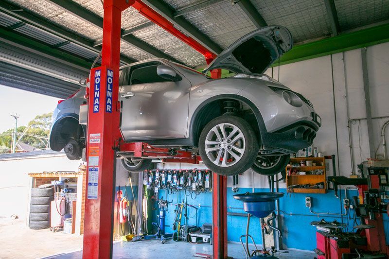 A car on a lift in a garage — Pendle Hill, NSW — Pendle Hill Automotive