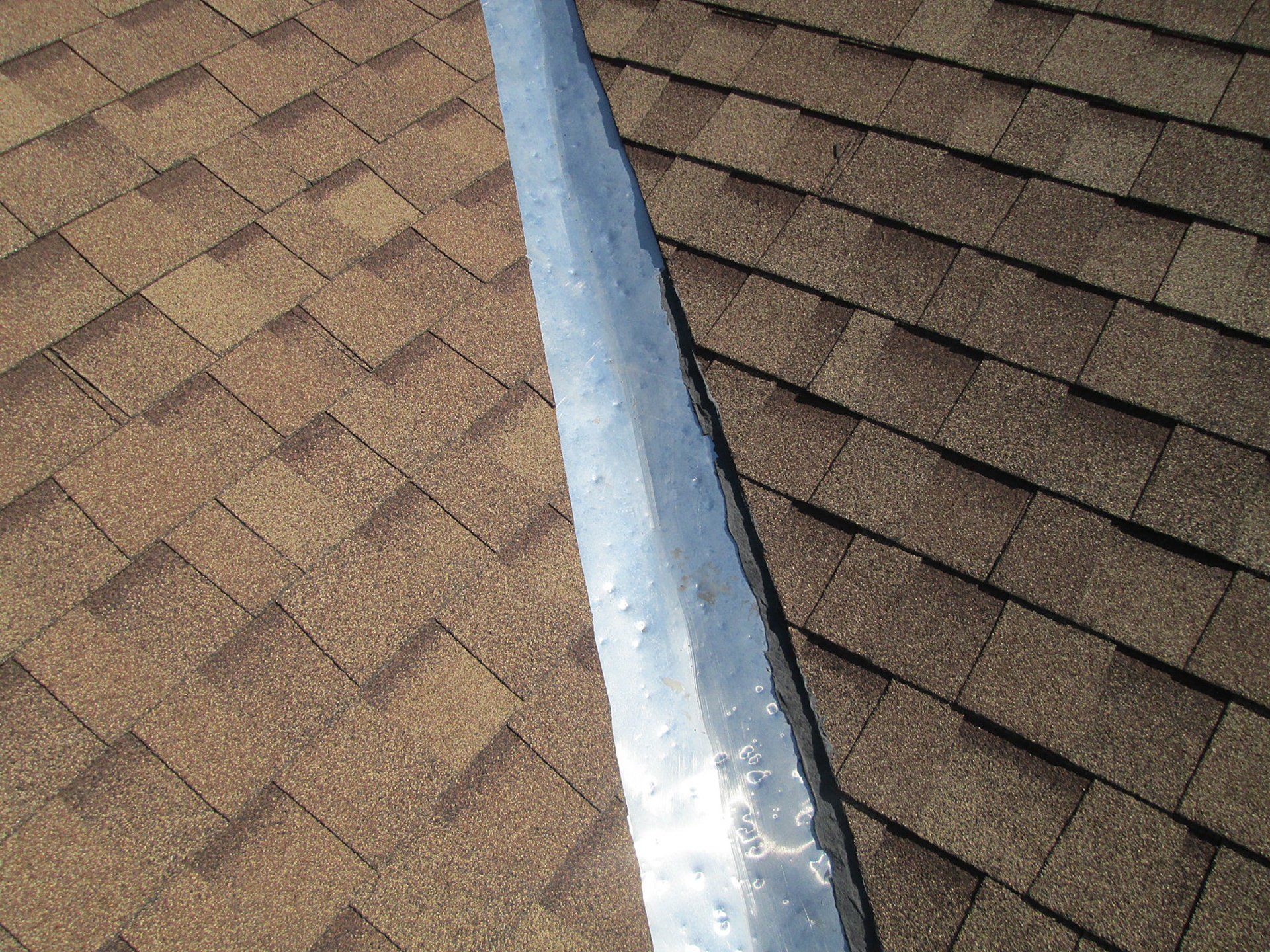 hail damage on roof valley