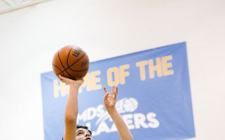 Teenager Playing Basketball