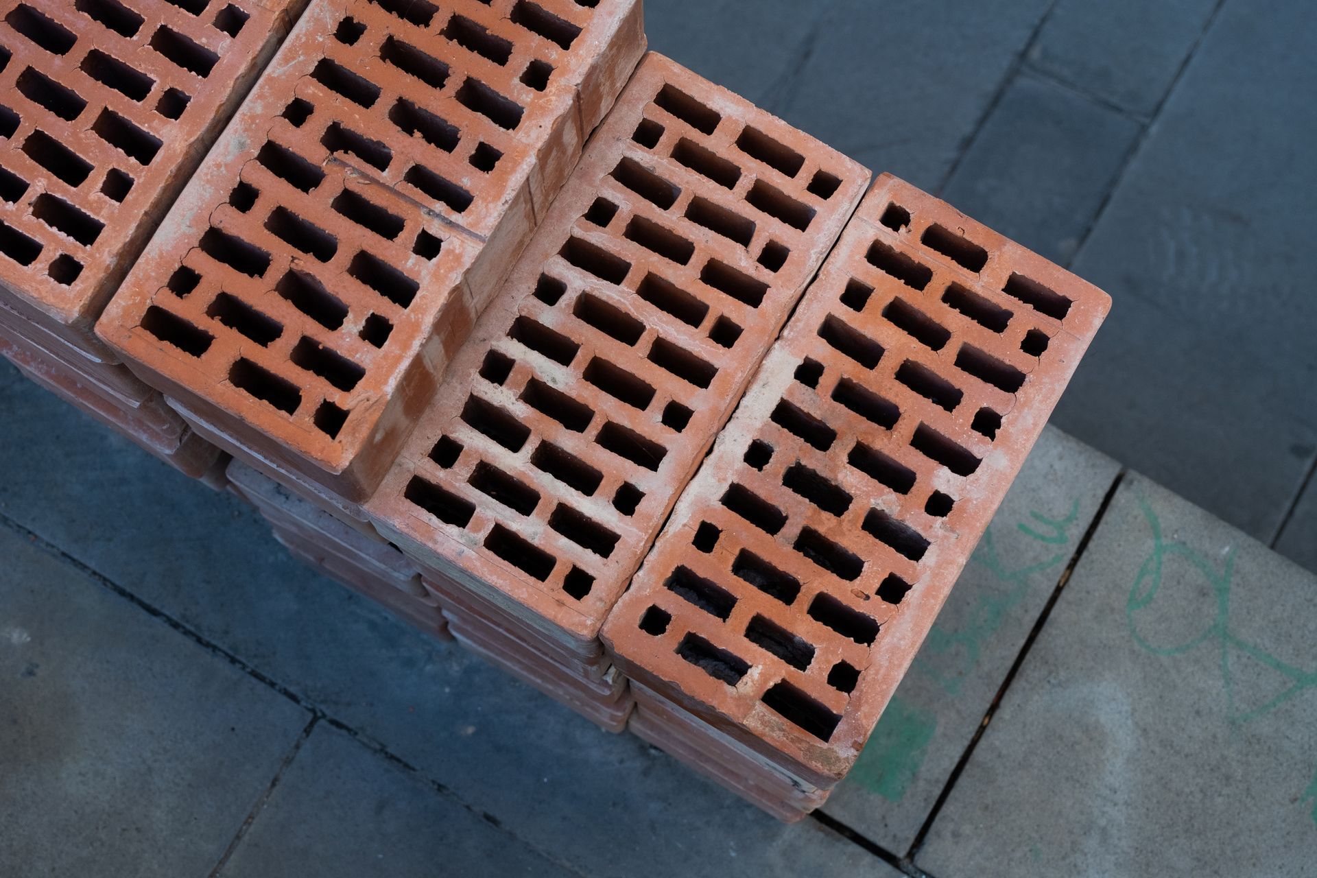 Red brick wall being built.