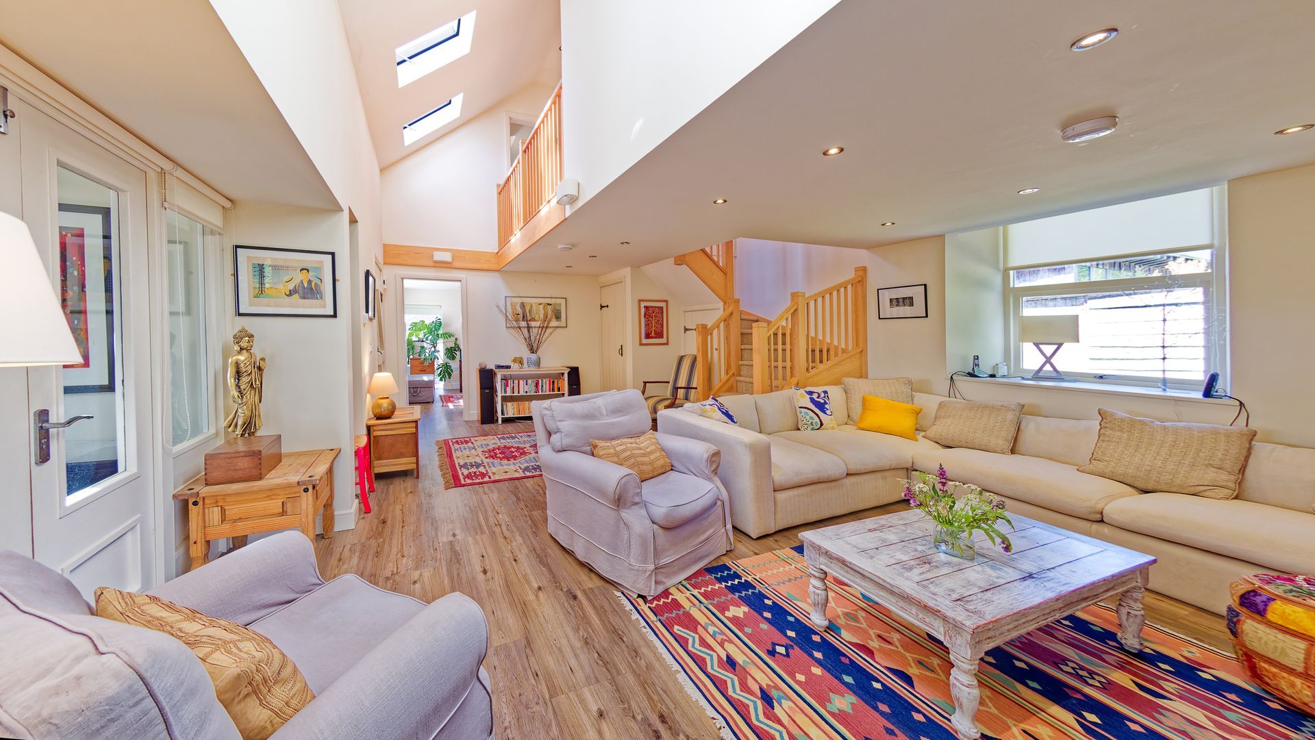 A living room with a comfortable sofa , chairs , and a coffee table.