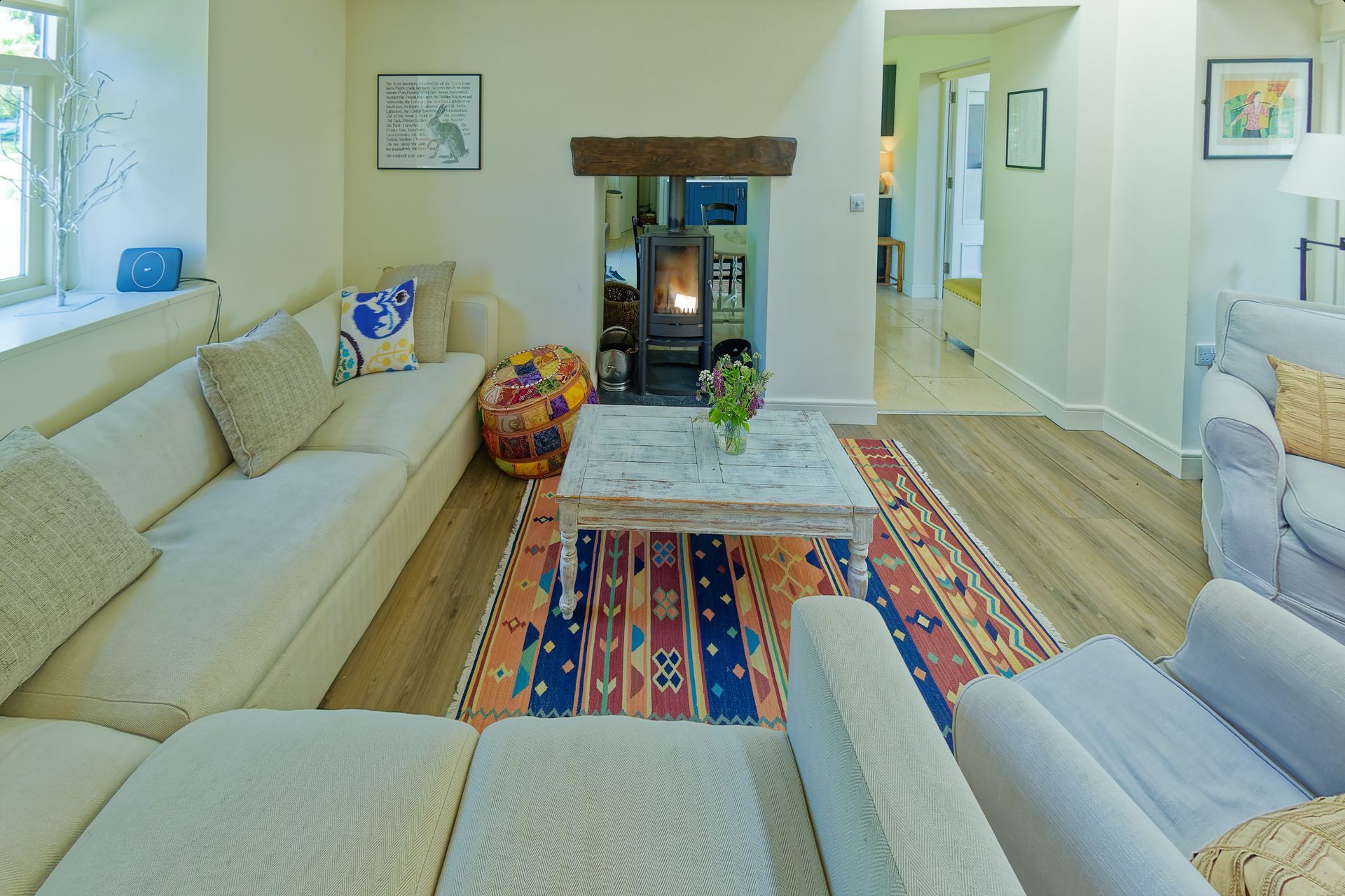 A living room filled with furniture and a fireplace.