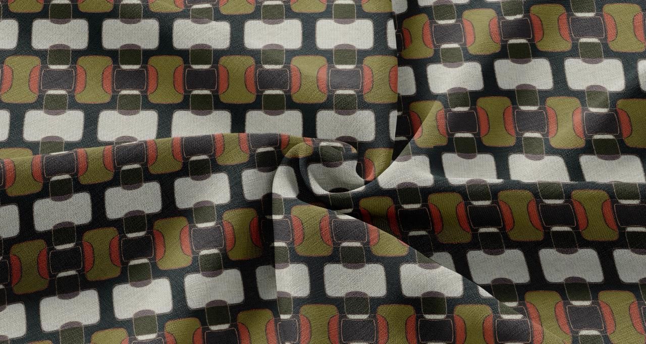 A folded fabric with a geometric grid pattern featuring rows of white rectangles and olive-green shapes on a black base.