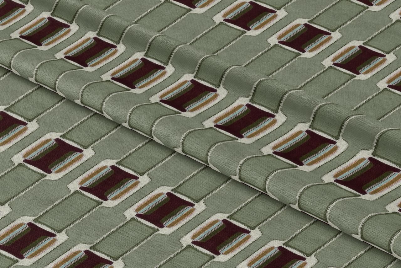 Textile featuring a geometric pattern of dark brown rectangles framed in cream on a sage green background.