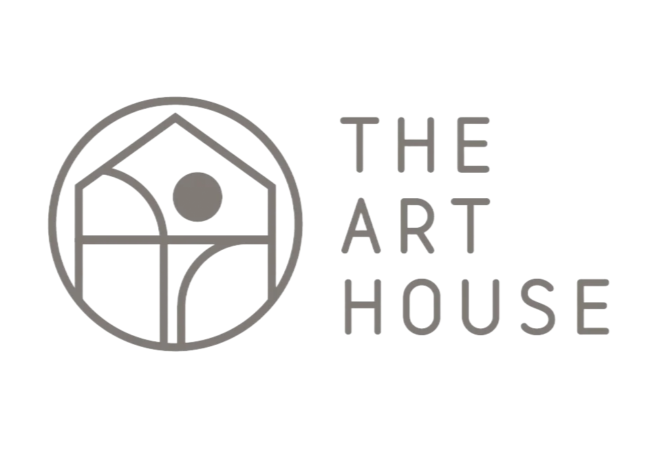 A grey logo featuring a stylized house icon within a circle, next to the text