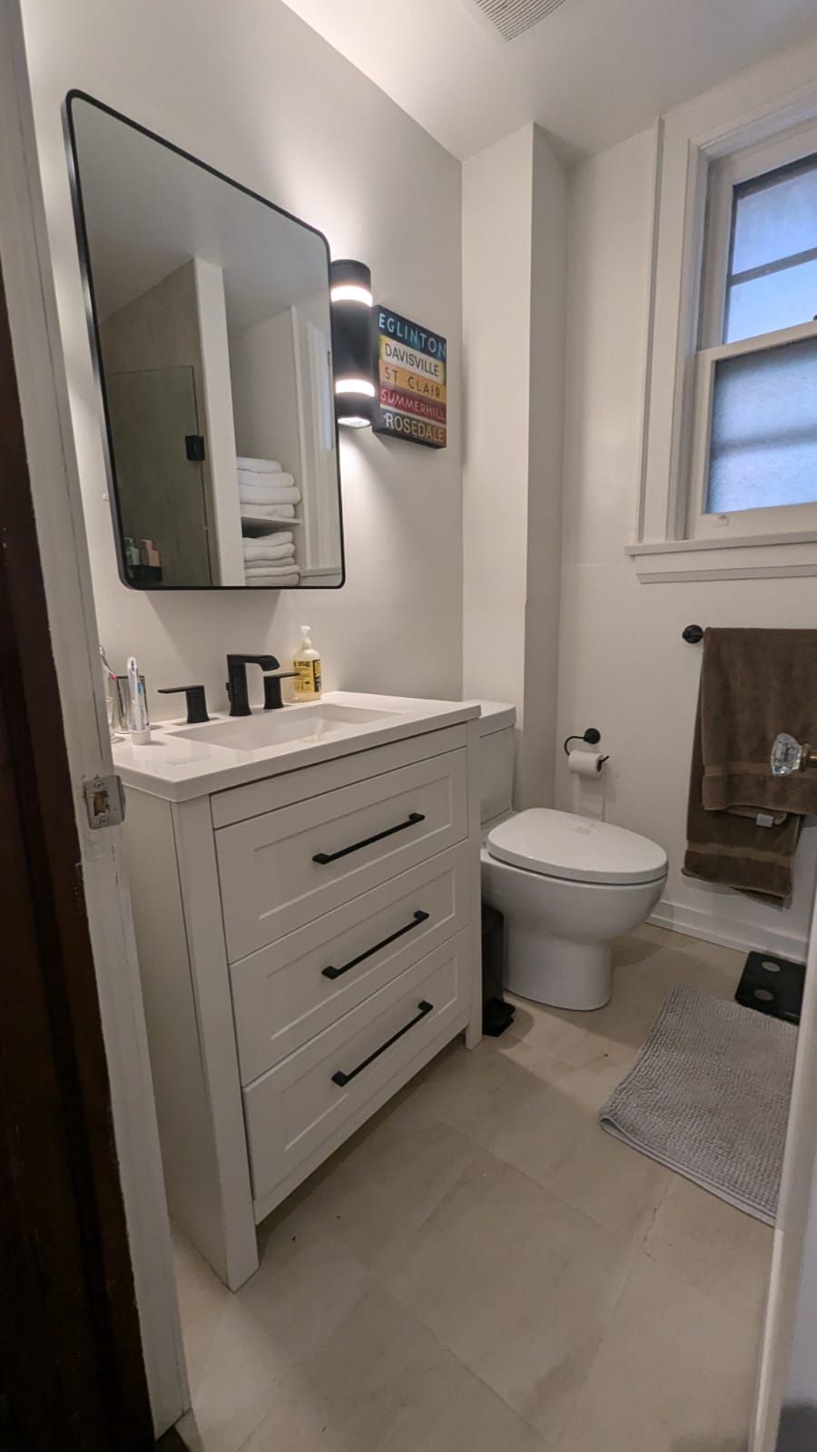 Interior view of a construction site. Wooden beams frame a doorway, exposing wiring.