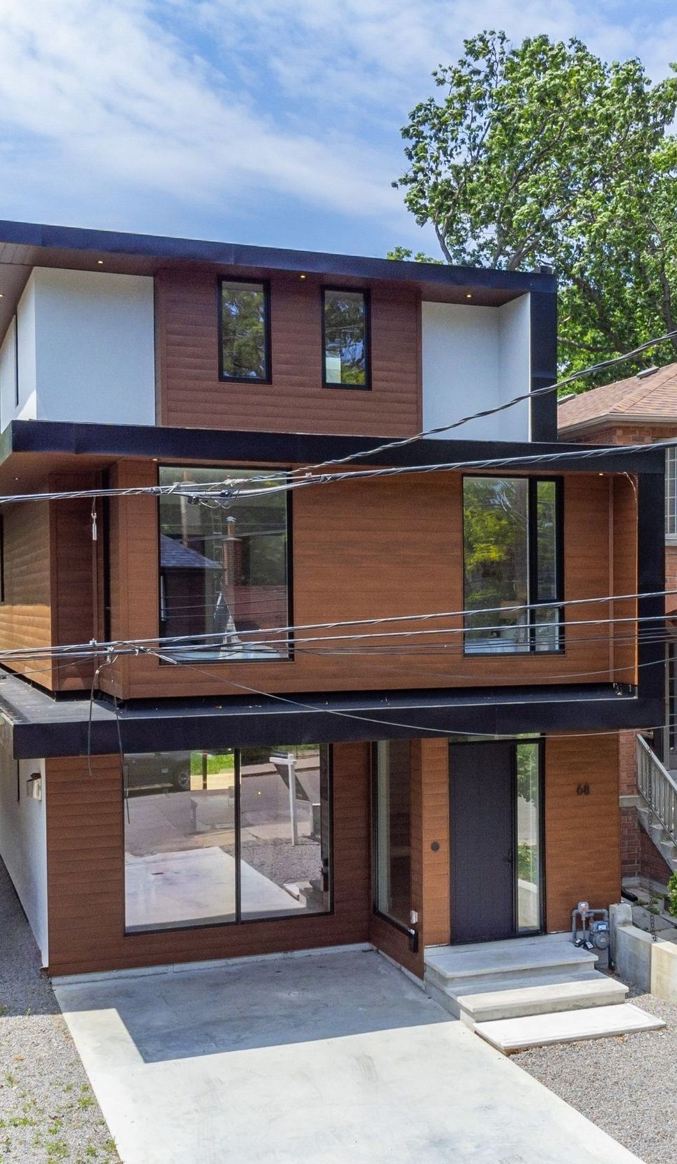 A large brick house with a lot of windows and stairs.