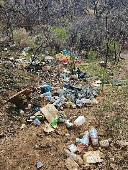 Trash covers the Blowout Wash area in Cottonwood, prior to a cleanup
